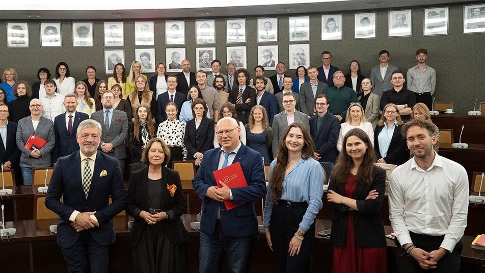  a group of people in an academic hall - 25th Anniversary of the UniLodz Law Clinic